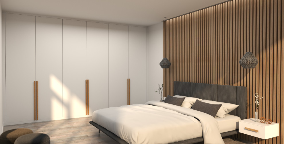 Fitted bedroom furniture with long wooden handles and wall panelling