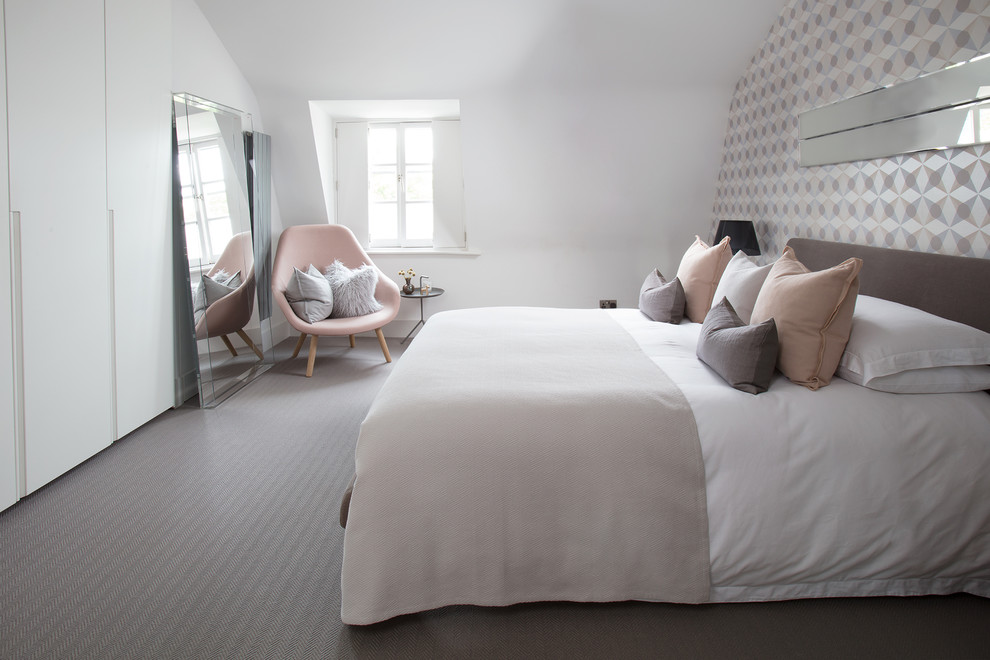 Medium sized scandinavian master and grey and pink bedroom in London with grey walls, carpet and grey floors.