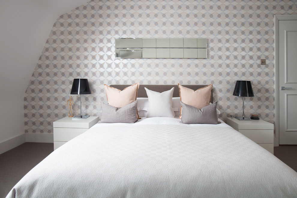 This is an example of a medium sized scandi master and grey and pink bedroom in London with white walls, carpet and grey floors.