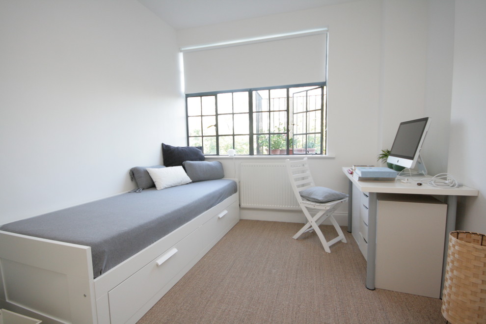Bedroom - contemporary bedroom idea in London with white walls