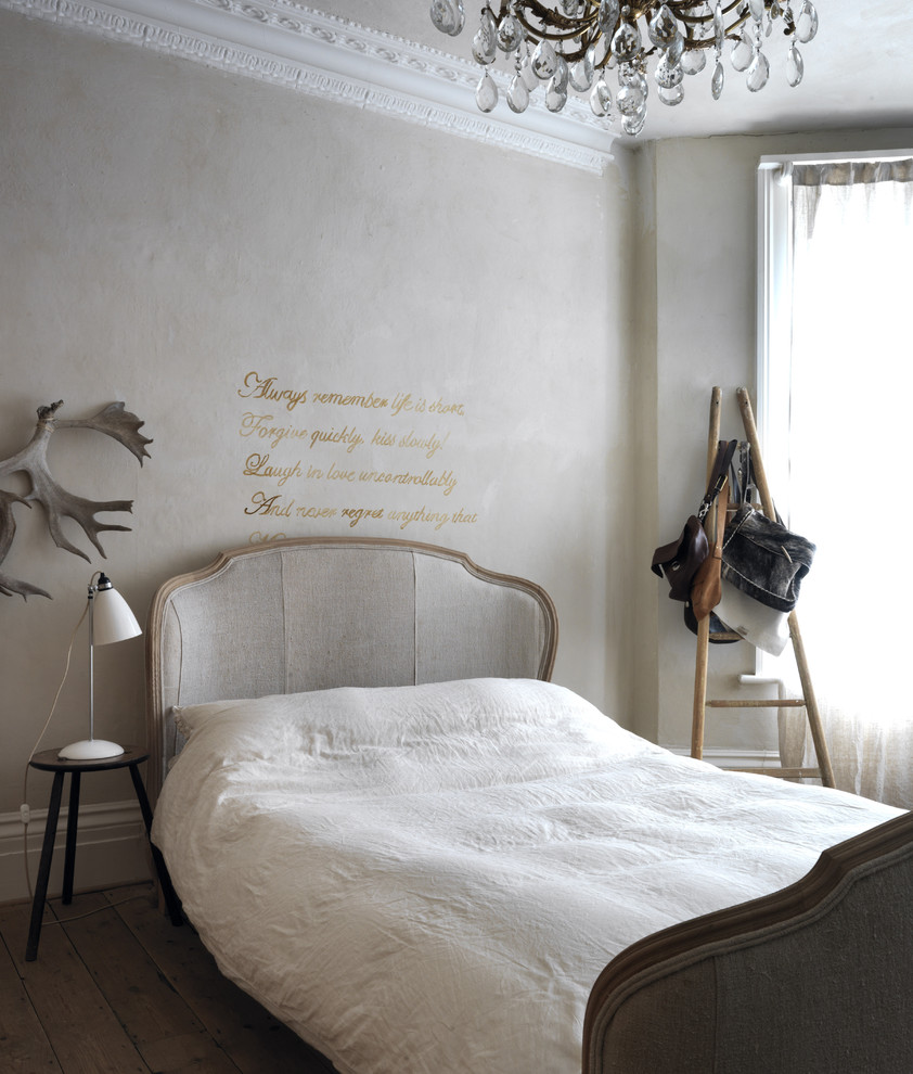 Photo of a rural bedroom in London with grey walls and dark hardwood flooring.