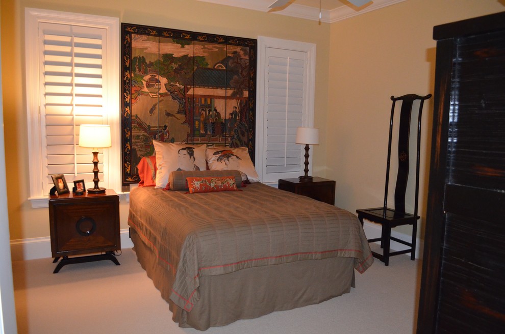 Example of a guest carpeted and beige floor bedroom design in New York with yellow walls