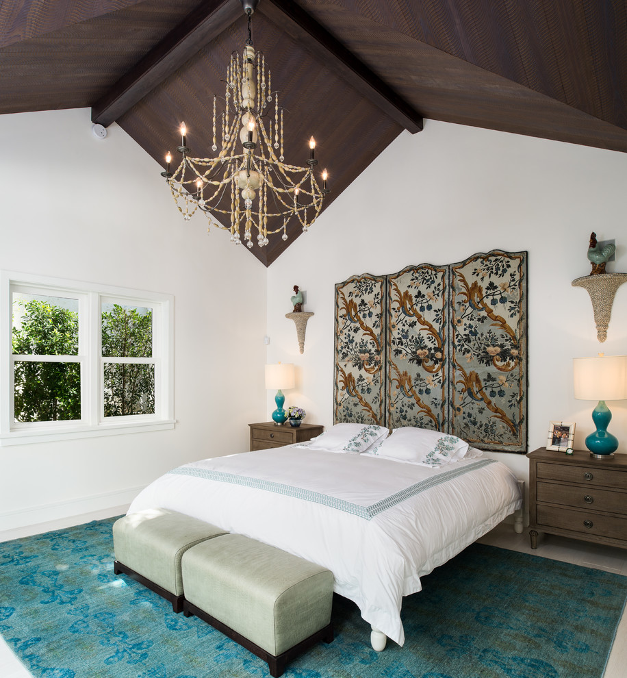 Mediterranean bedroom in Miami with white walls and blue floors.