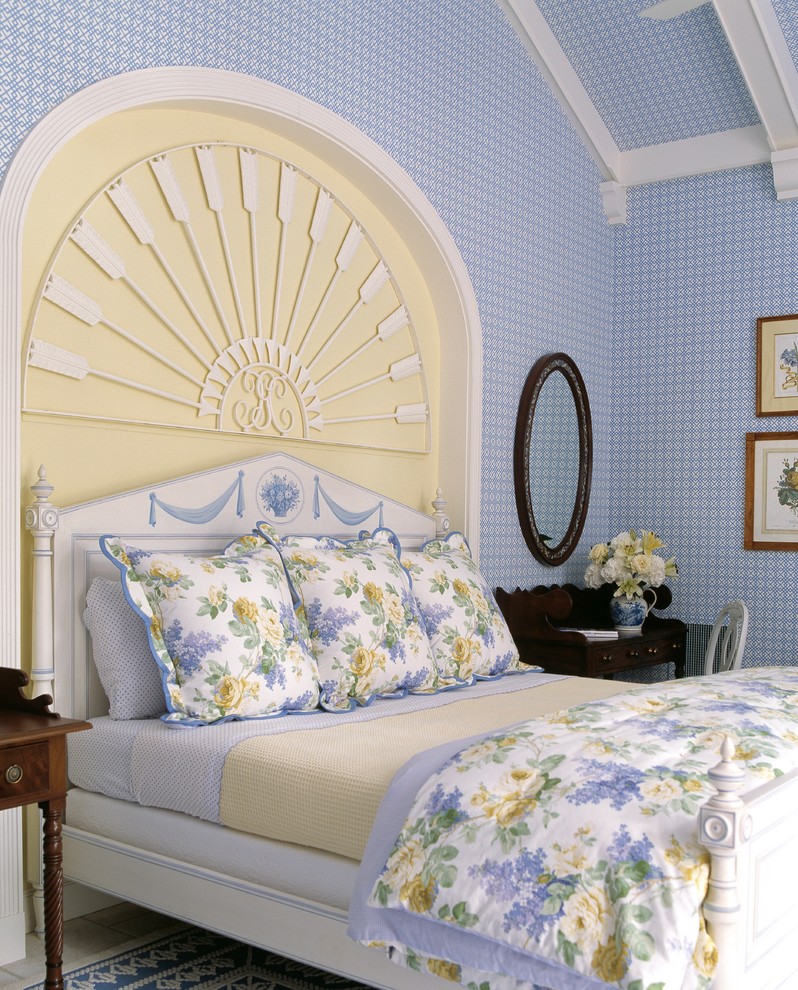 Inspiration for a tropical bedroom remodel in Miami with blue walls