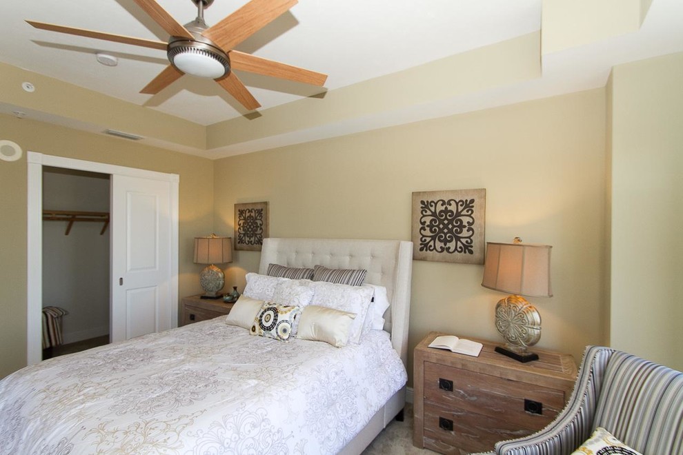 Bedroom - mid-sized contemporary guest carpeted bedroom idea in Miami with beige walls