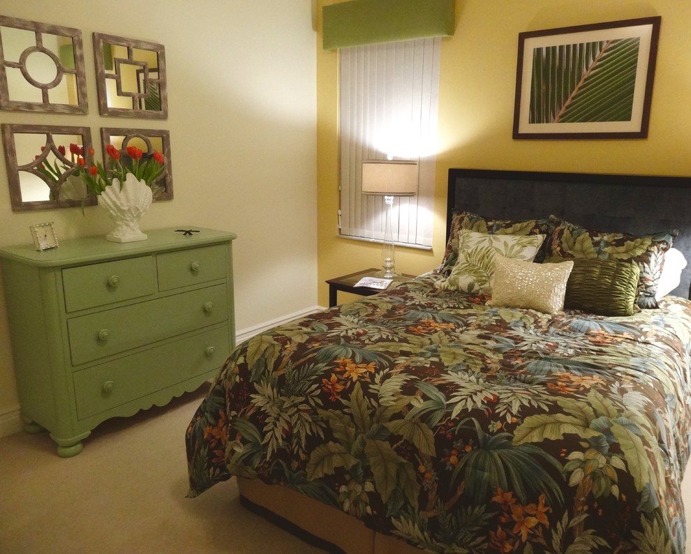 Inspiration for a mid-sized transitional master carpeted bedroom remodel in Orange County with green walls and no fireplace