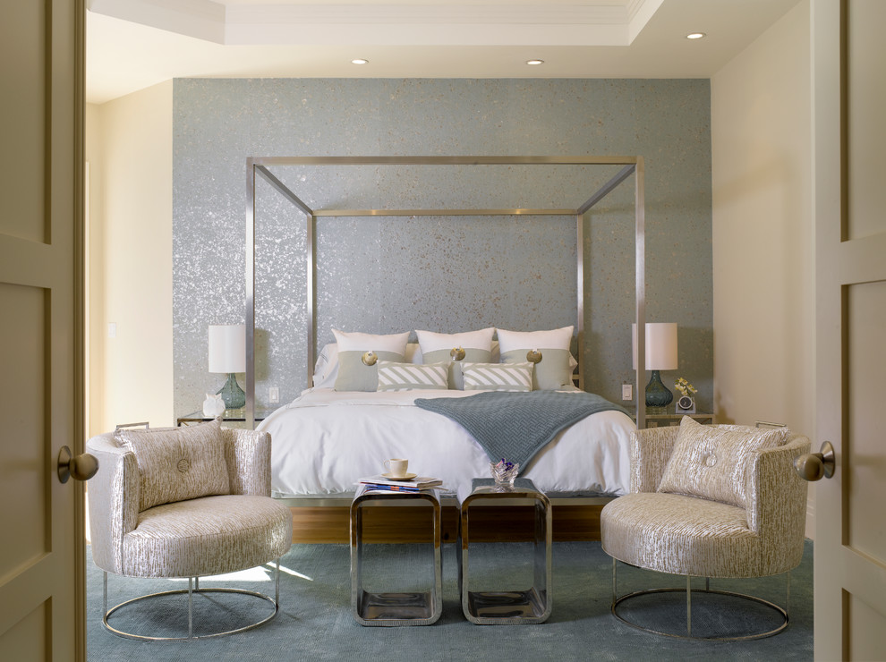 This is an example of a contemporary bedroom in Miami with beige walls, carpet and a feature wall.