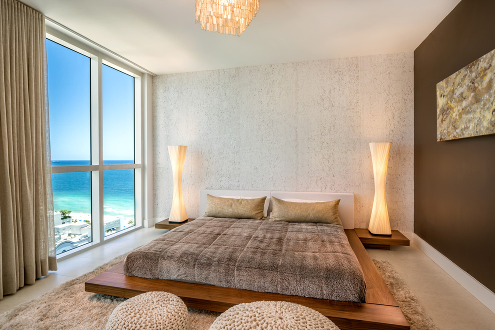 Mid-sized trendy master porcelain tile and beige floor bedroom photo in Miami with brown walls