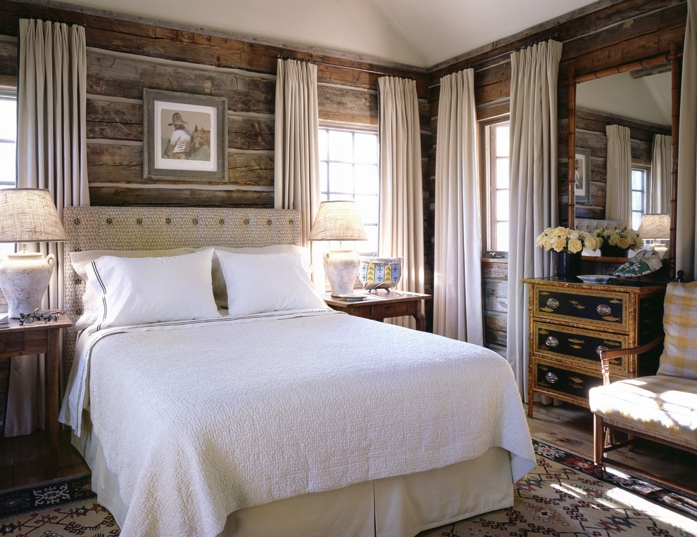 Example of a mountain style bedroom design in Other with brown walls