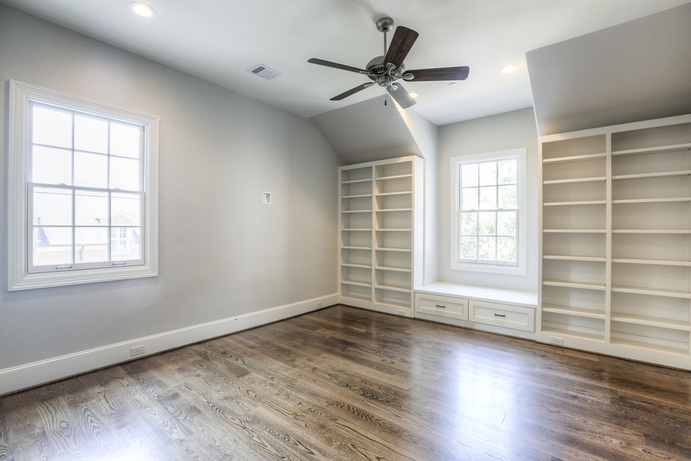 Photo of a large classic master bedroom in Houston with grey walls, dark hardwood flooring, no fireplace and brown floors.