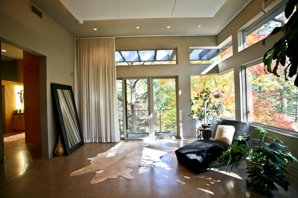 Bedroom - large contemporary master concrete floor and beige floor bedroom idea in Baltimore with beige walls