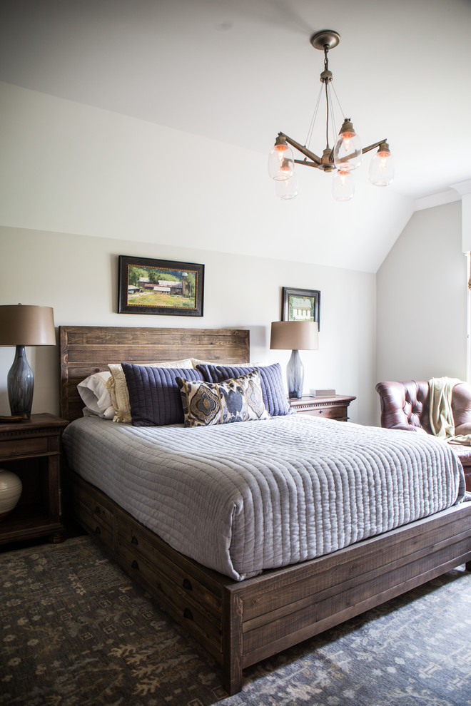 This is an example of a medium sized classic master bedroom in Nashville with beige walls and dark hardwood flooring.