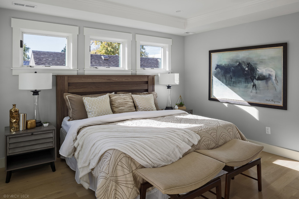 Design ideas for a medium sized traditional guest bedroom in Denver with grey walls, light hardwood flooring and beige floors.