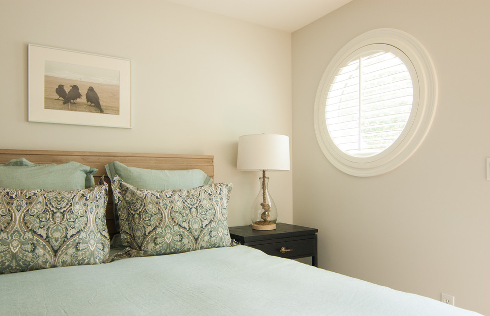 Bedroom - mid-sized coastal master medium tone wood floor and brown floor bedroom idea in Portland Maine with gray walls