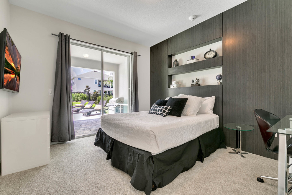 Medium sized contemporary guest bedroom in Orlando with grey walls, carpet, no fireplace and grey floors.