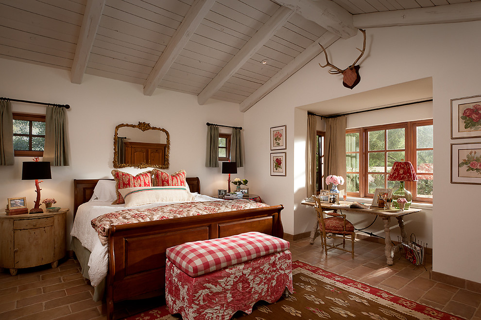 Bedroom - french country terra-cotta tile bedroom idea in Phoenix with white walls