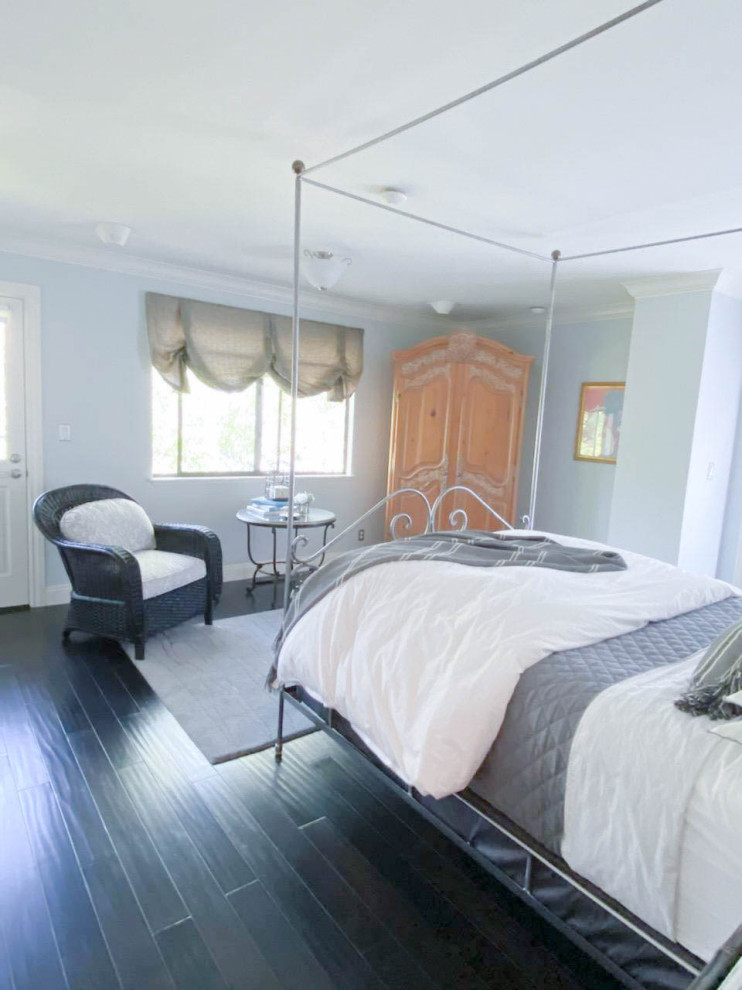 Inspiration for a medium sized guest bedroom with blue walls, dark hardwood flooring and brown floors.