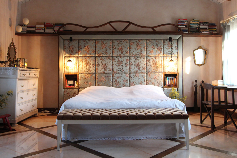 Example of an eclectic marble floor bedroom design in London