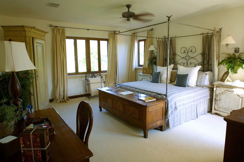 Example of a large french country master carpeted bedroom design in Other with white walls and no fireplace