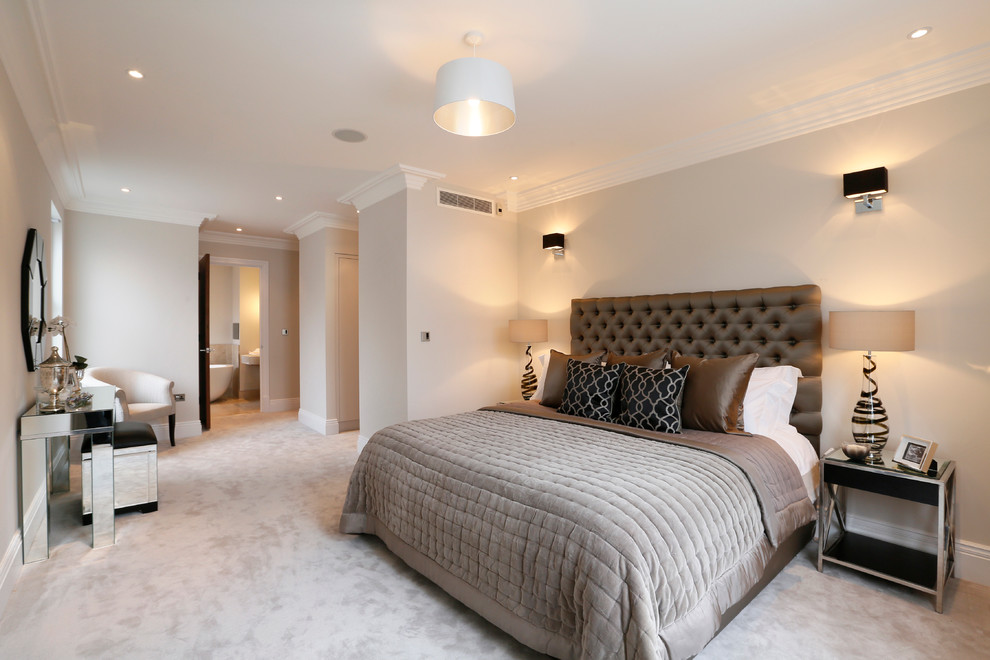 This is an example of a contemporary master and grey and brown bedroom in London with grey walls, carpet and feature lighting.