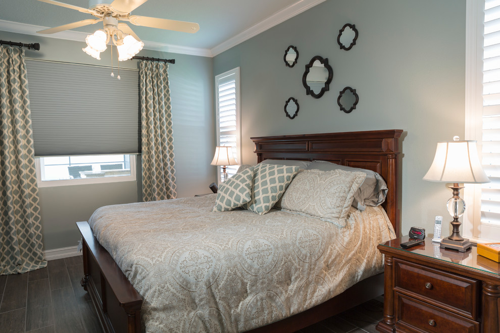 Design ideas for a medium sized traditional master bedroom in Tampa with green walls and porcelain flooring.