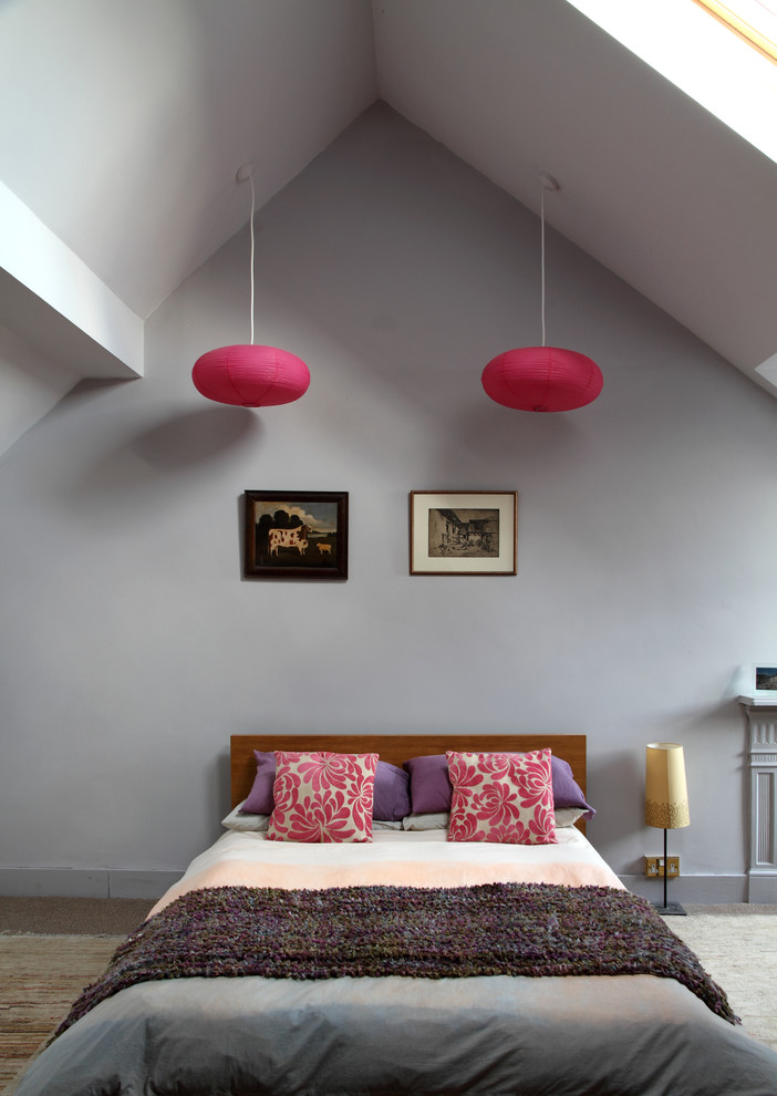Inspiration for a large eclectic master and grey and pink bedroom in London with grey walls and carpet.