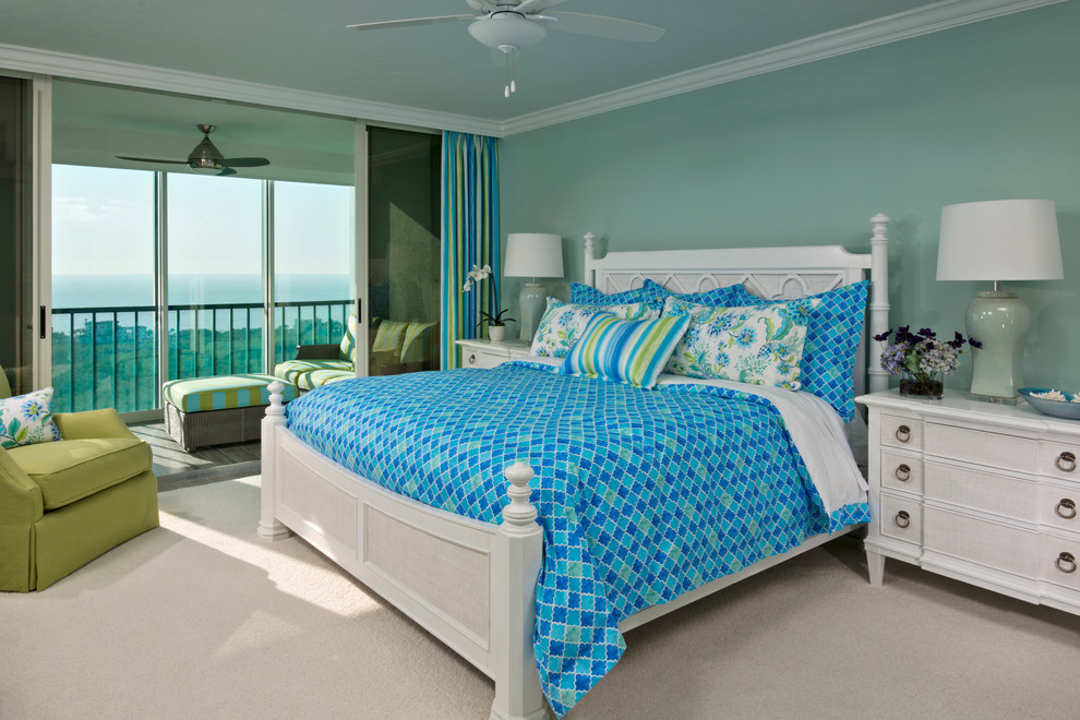 This is an example of a medium sized nautical guest bedroom in Miami with green walls and carpet.
