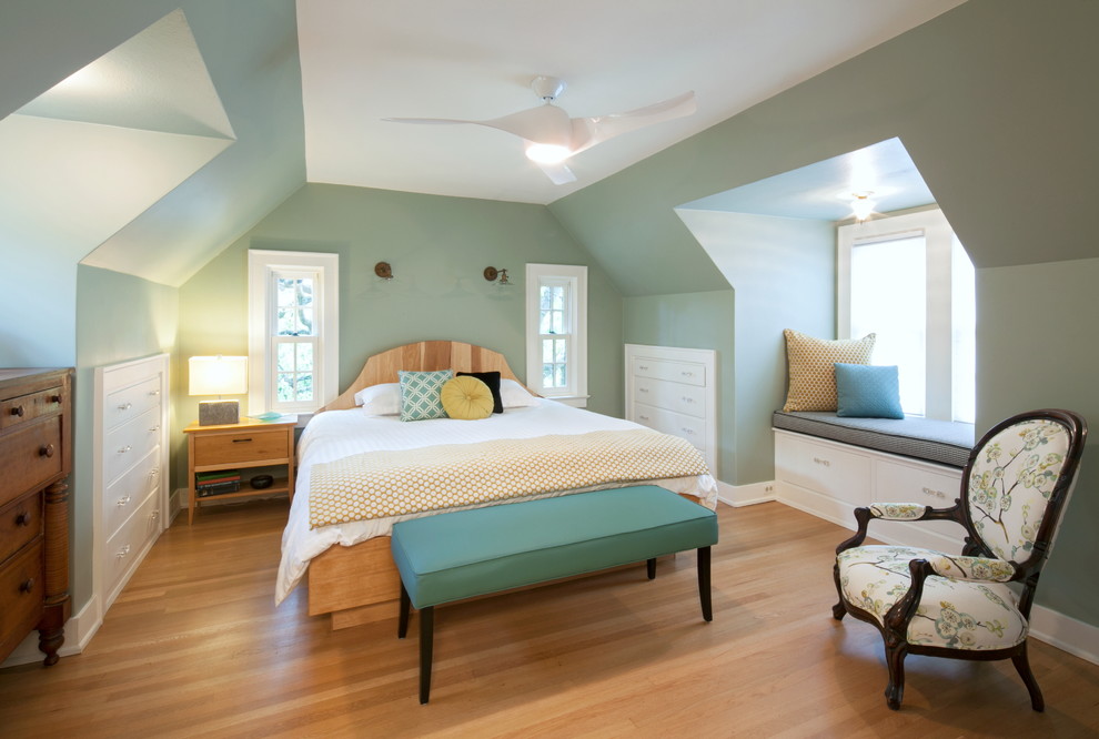 Example of a mid-sized eclectic medium tone wood floor bedroom design in Portland with blue walls