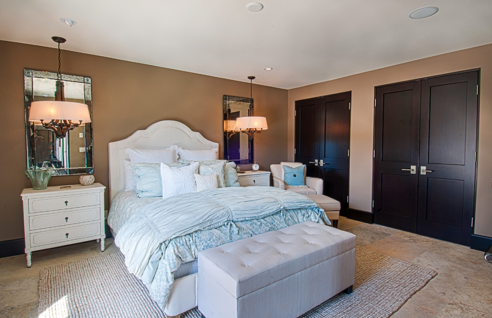 Example of a tuscan bedroom design in Orange County