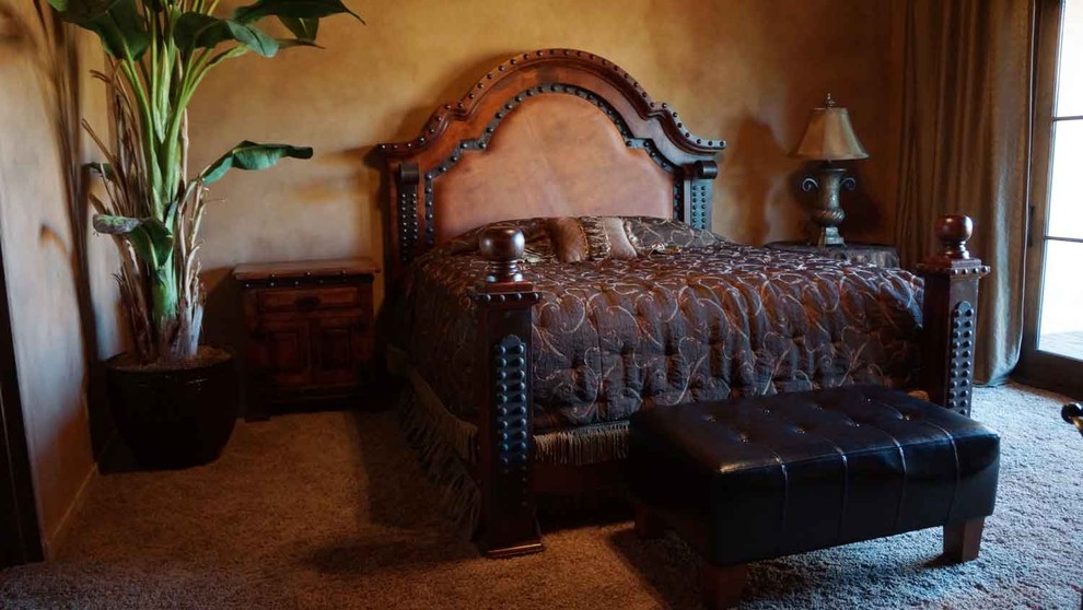 Bedroom - large mediterranean master carpeted bedroom idea in Los Angeles with beige walls