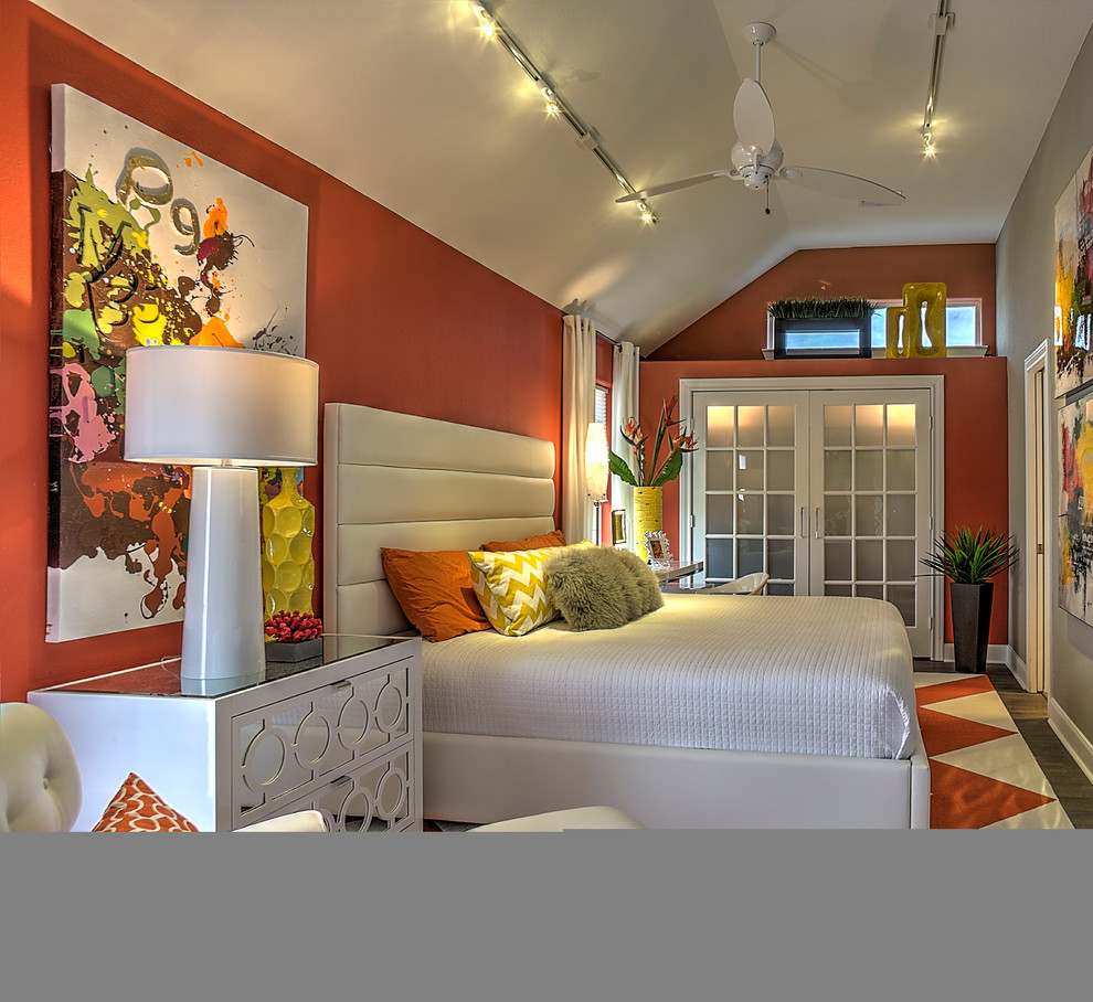 Inspiration pour une chambre d'amis design avec un mur orange et un sol en carrelage de porcelaine.