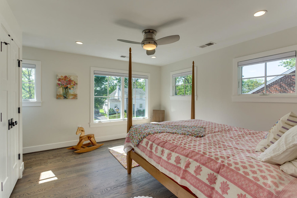Photo of a large traditional master bedroom in DC Metro with white walls, medium hardwood flooring and no fireplace.