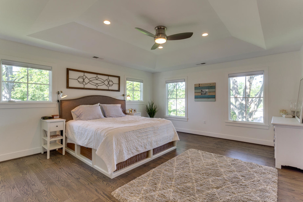 Design ideas for a large traditional master bedroom in DC Metro with white walls, medium hardwood flooring and no fireplace.