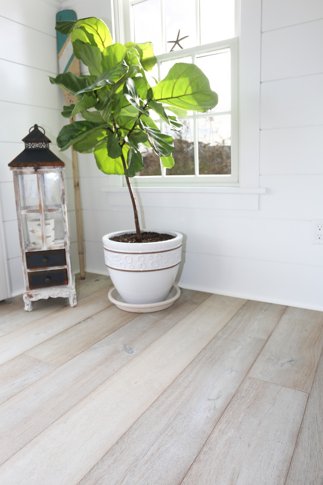 Bedroom - modern guest light wood floor and gray floor bedroom idea in Boston with white walls