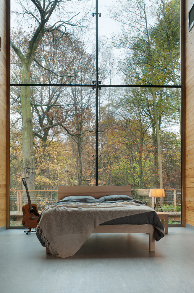Example of a minimalist bedroom design in Other with no fireplace