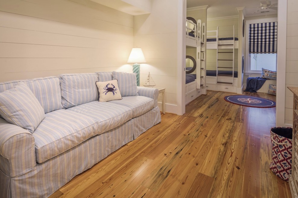 Bedroom - large coastal light wood floor bedroom idea in Charleston with beige walls