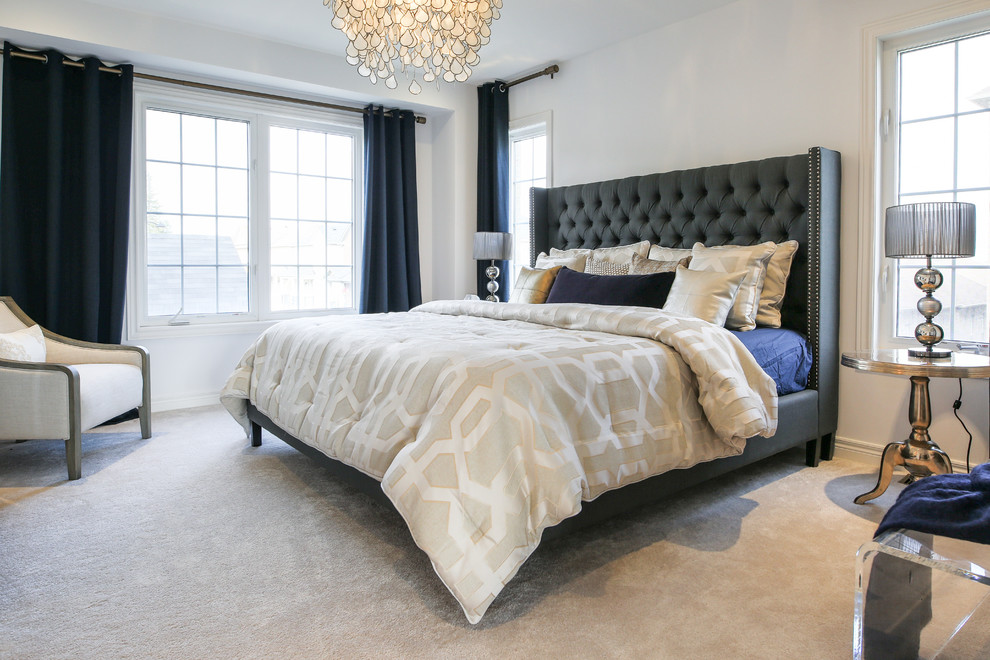 Example of a mid-sized transitional master carpeted and gray floor bedroom design in Toronto with white walls
