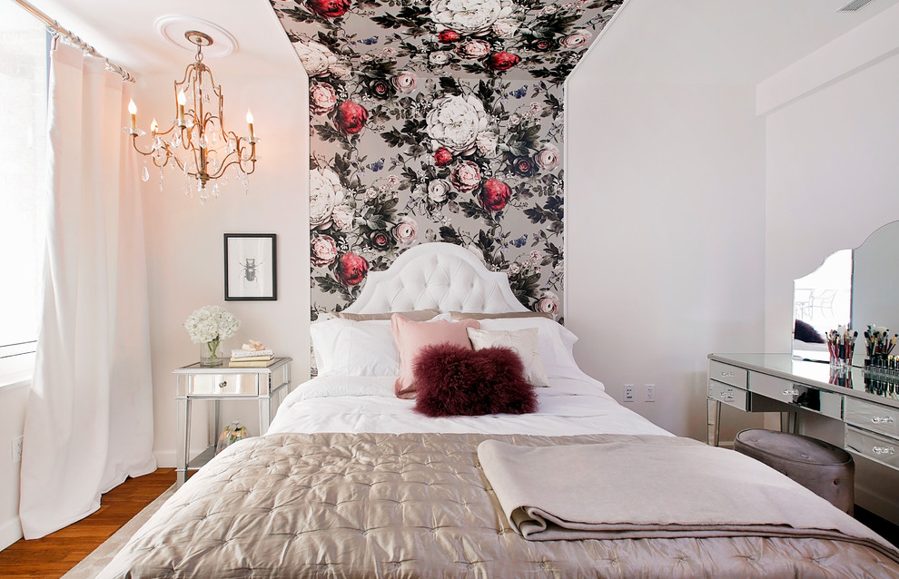 This is an example of a small contemporary guest bedroom in New York with light hardwood flooring and multi-coloured walls.