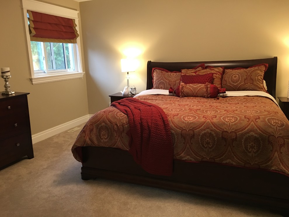 Example of a mid-sized transitional master carpeted bedroom design in Toronto with beige walls