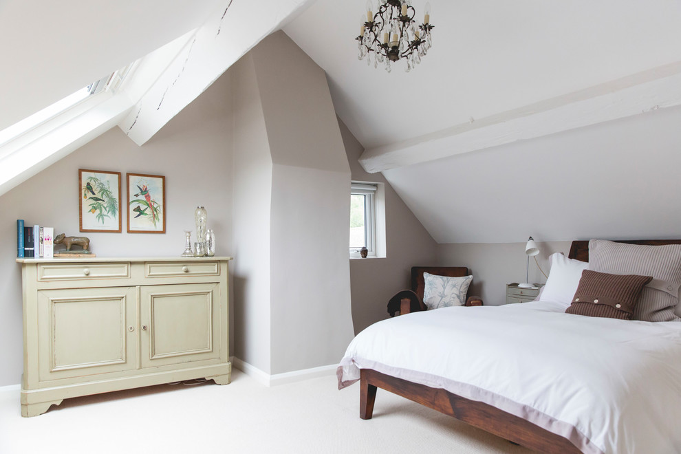Country bedroom in London with beige walls, carpet and white floors.