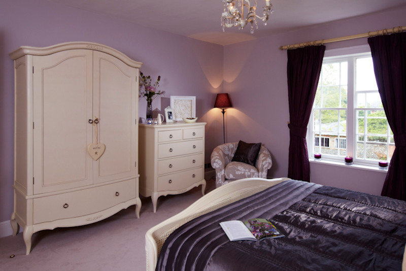 Inspiration for a medium sized classic guest bedroom in Other with purple walls and carpet.