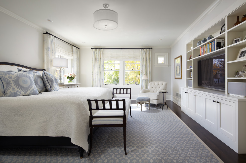 Example of a classic dark wood floor bedroom design in Minneapolis with white walls and no fireplace