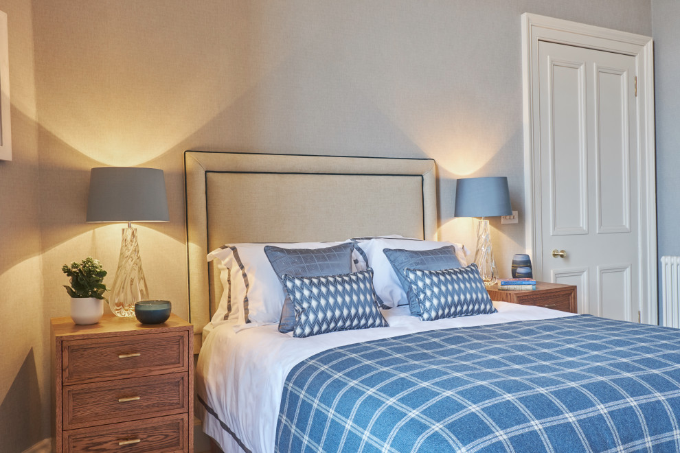 Inspiration for a large transitional master bedroom remodel in Edinburgh with blue walls