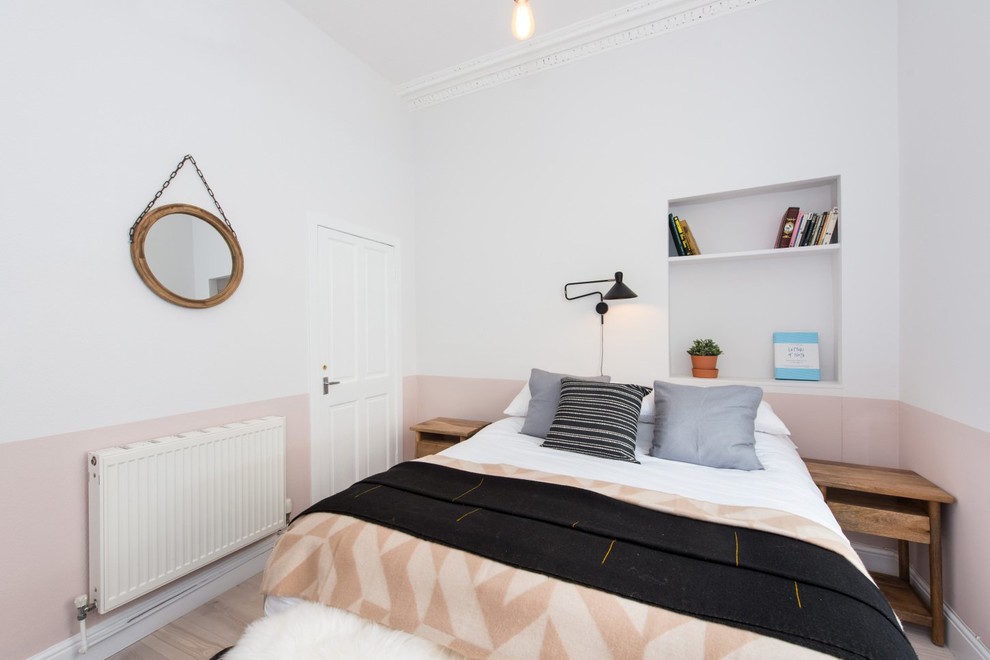Scandi grey and pink bedroom in Edinburgh with multi-coloured walls, light hardwood flooring and no fireplace.