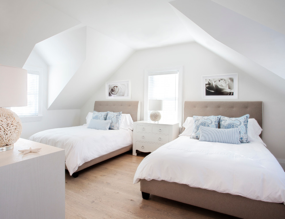 Design ideas for a coastal guest bedroom in Boston with white walls, light hardwood flooring and no fireplace.