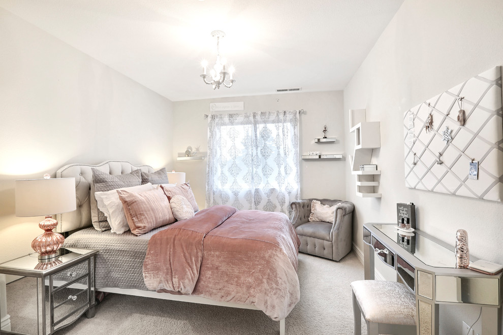 Inspiration for a small romantic guest and grey and pink bedroom in Other with beige walls, carpet and feature lighting.