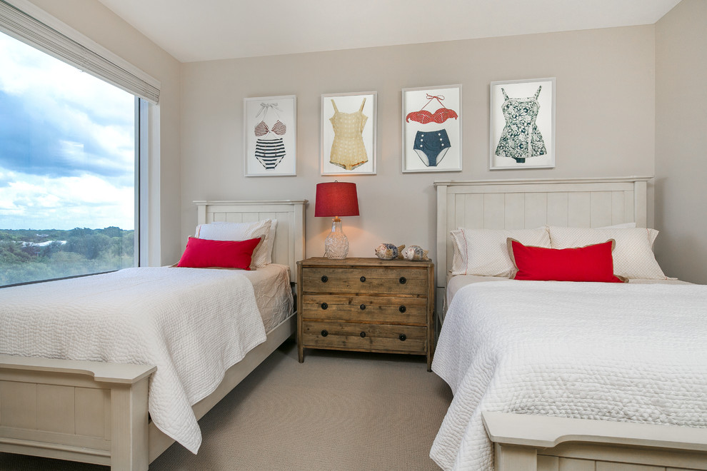 Inspiration for a mid-sized coastal guest carpeted bedroom remodel in Tampa with beige walls