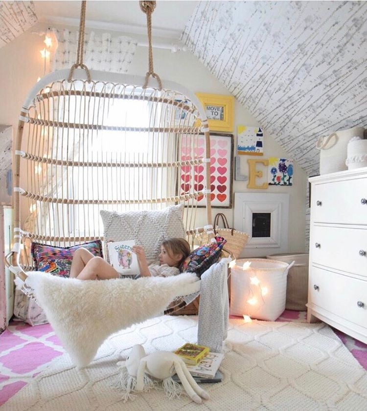 Photo of a medium sized bohemian mezzanine bedroom in New York with multi-coloured walls and light hardwood flooring.