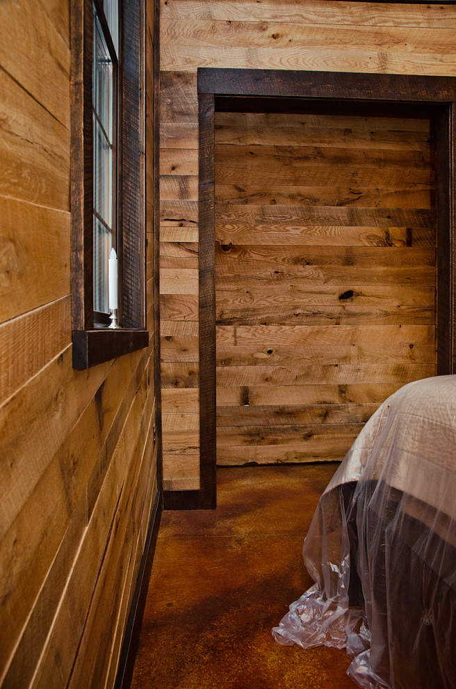 Inspiration for a medium sized rustic guest bedroom in Other with brown walls.