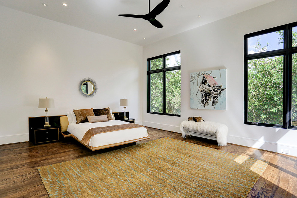 Inspiration for a huge contemporary master medium tone wood floor and brown floor bedroom remodel with white walls